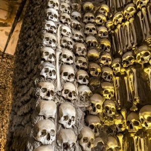 Chapel of Bones interior with walls decorated with human skulls and bones in Évora