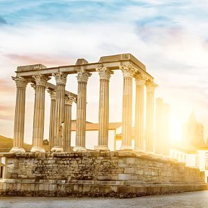 Roman Temple of Évora with ancient Corinthian columns under a clear sky