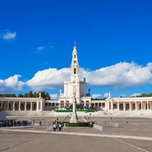 Fatima religious sanctuary with pilgrims gathered outside in Portugal